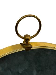 Tommi Parzinger MID CENTURY BRASS FRAMED OVAL MIRROR WITH RING IN THE MANNER OF TOMMI PARZINGER - 4695556