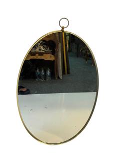 Tommi Parzinger MID CENTURY BRASS FRAMED OVAL MIRROR WITH RING IN THE MANNER OF TOMMI PARZINGER - 4695557