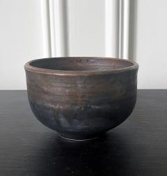 Toshiko Takaezu Ceramic Tea Bowl with Black Iridescent Glaze by Toshiko Takaezu - 2530649