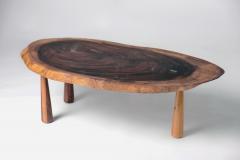 Tree slice coffee table with conical legs - 1889367