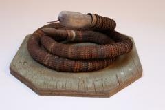 Vintage Folk Art Hand Carved Wood and Bottlecap Snake on Octagonal Base - 3934314