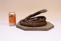 Vintage Folk Art Hand Carved Wood and Bottlecap Snake on Octagonal Base - 3934316