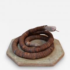 Vintage Folk Art Hand Carved Wood and Bottlecap Snake on Octagonal Base - 3940023