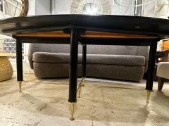 Vintage Italian Oval Ebonized Dining Table resting on a Bronze Base - 4512412