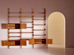 Wall mounted bookcase with wooden uprights and modules Italy 1950s - 3946920