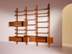 Wall mounted bookcase with wooden uprights and modules Italy 1950s - 3946922