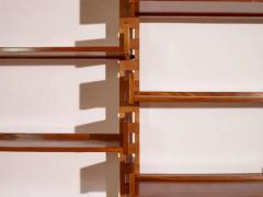 Wall mounted bookcase with wooden uprights and modules Italy 1950s - 3946923