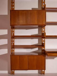 Wall mounted bookcase with wooden uprights and modules Italy 1950s - 3946951