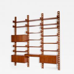 Wall mounted bookcase with wooden uprights and modules Italy 1950s - 3948521