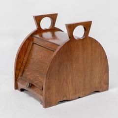 William James Neatby W J Neatby attri An Arts Crafts oak coal box with stylized carrying handles - 4188781