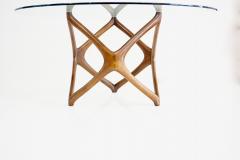 pierluigi Giordani Pierluigi Giordani round coffee table carved wood and crystal top 1950 - 3726880