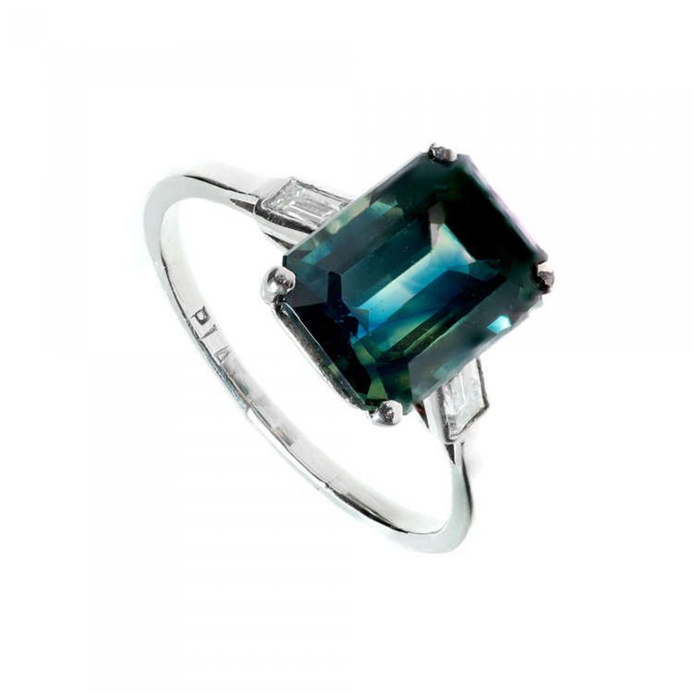 platinum ring with green stone