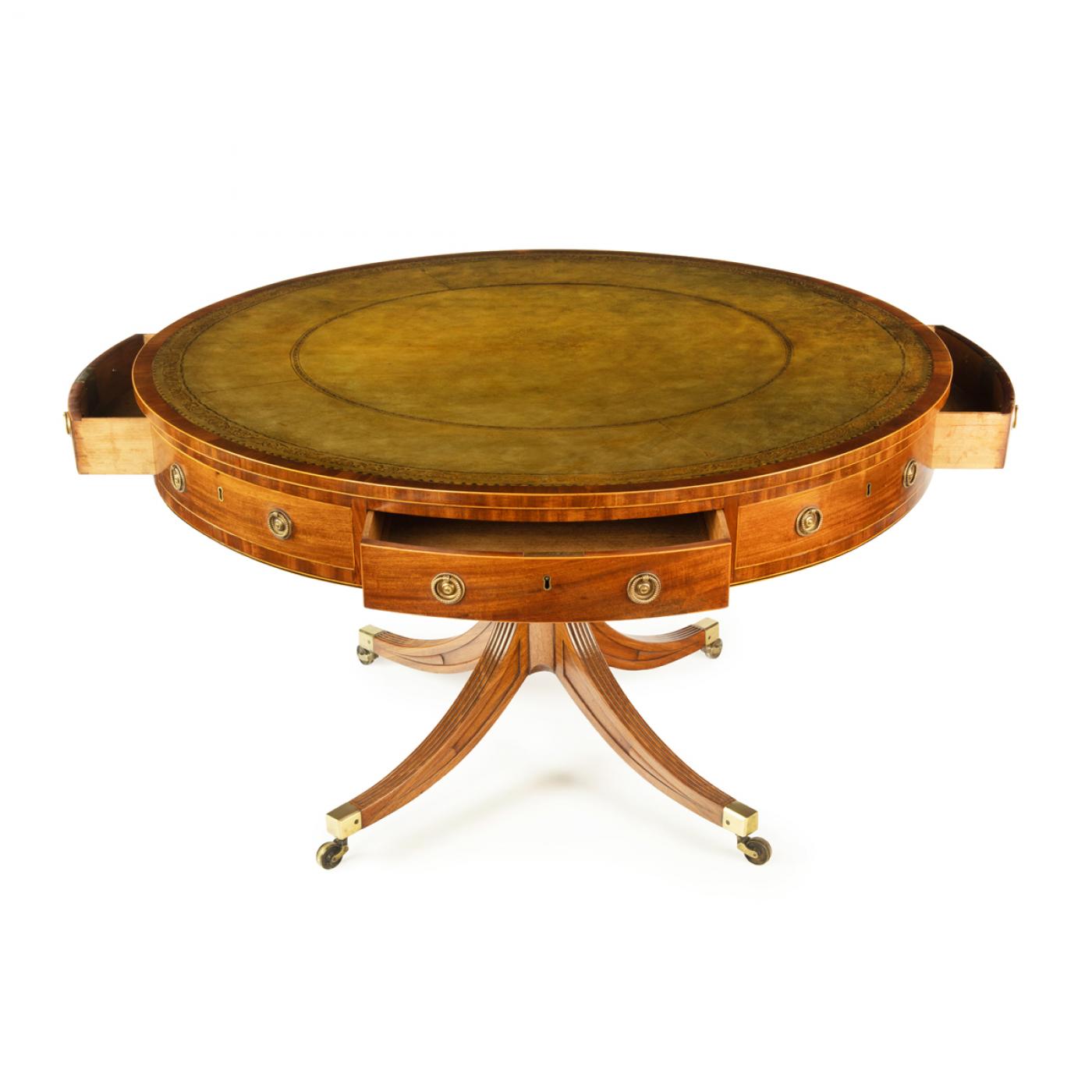 A George III revolving mahogany drum table attributed to Gillows
