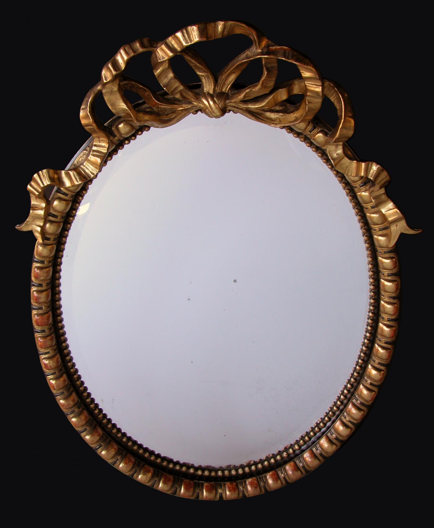 A Large-Scaled Napoleon III Carved Oval Mirror