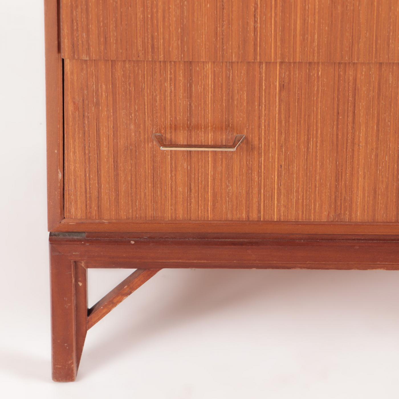 A Mid Century Danish teakwood six drawer highboy dresser, circa 1950.