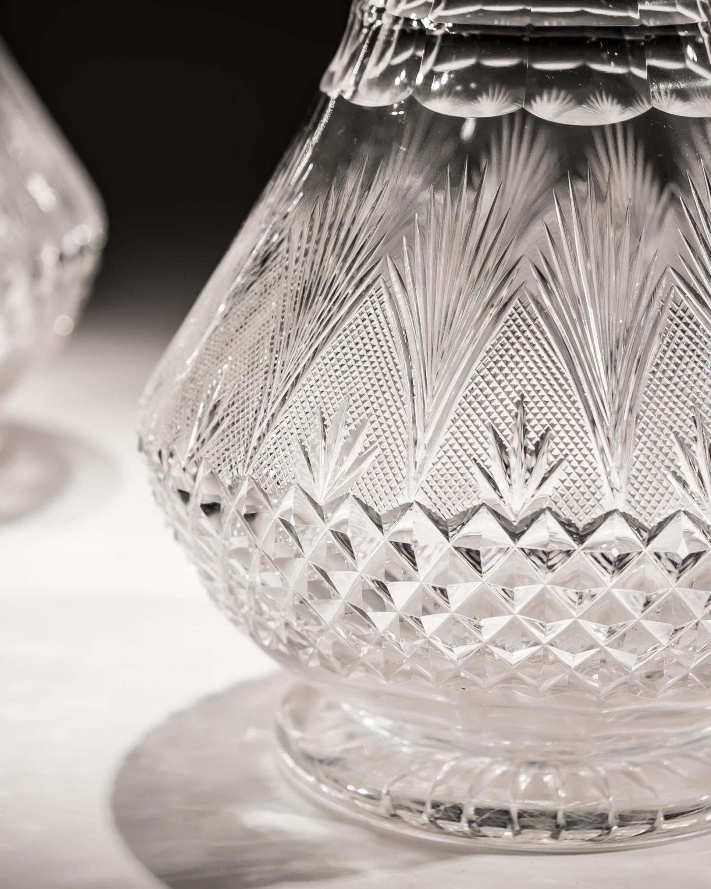 A PAIR OF ELABORATELY CUT VICTORIAN DECANTERS
