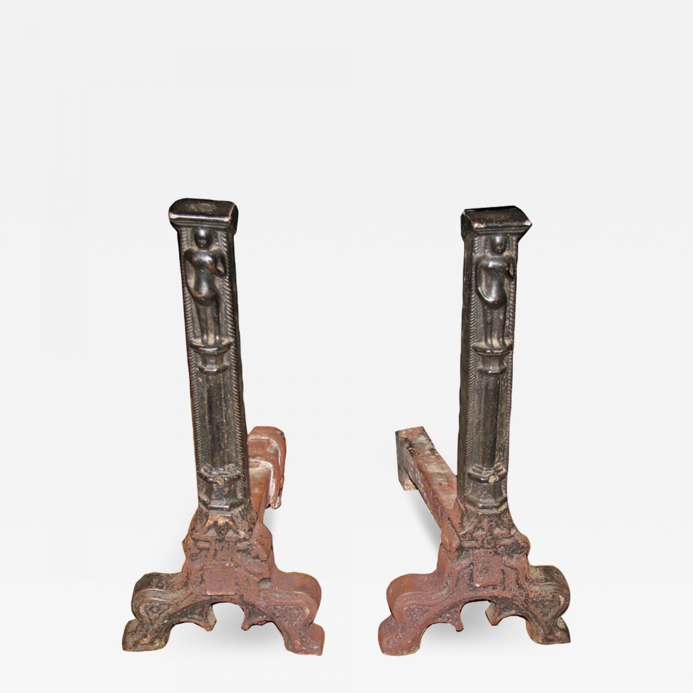 A pair of wrought iron Gothic candlesticks