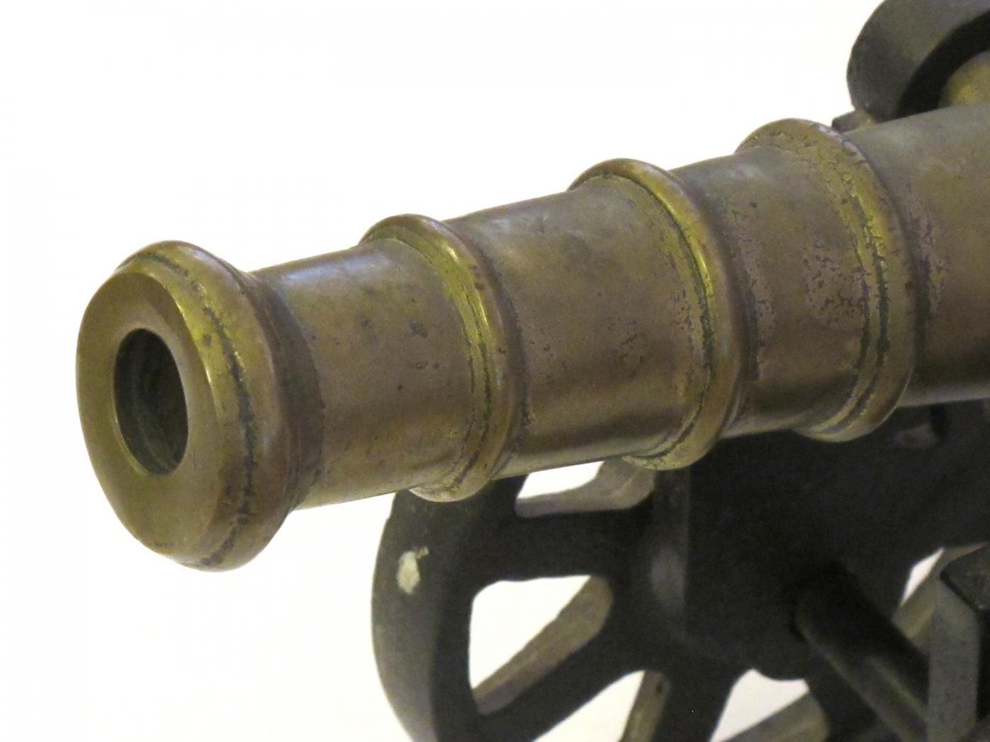 A Pair of Victorian Brass Ornamental Signal Cannons on Cast Iron Carriages