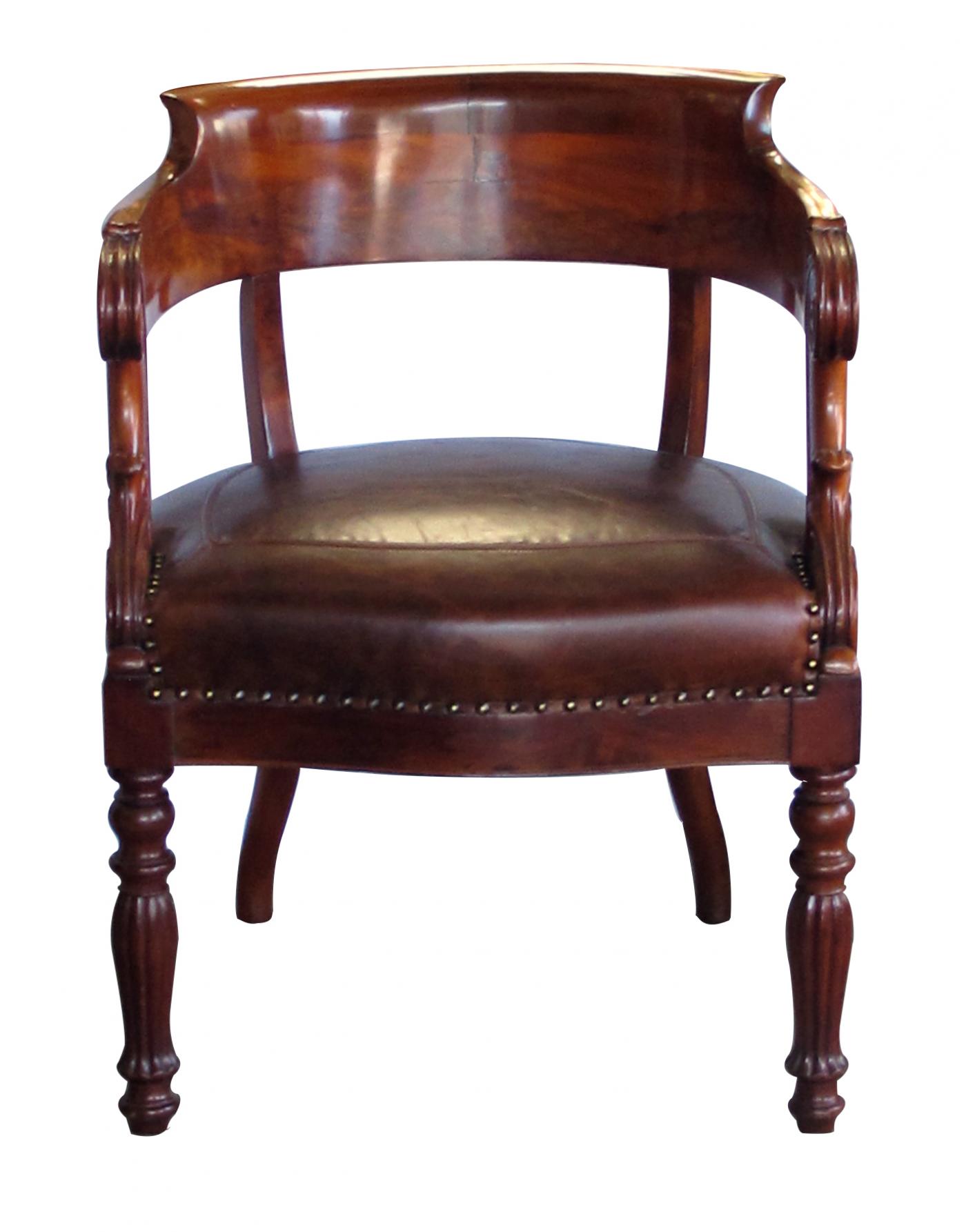 A dramatically-carved French restoration barrel-back desk chair
