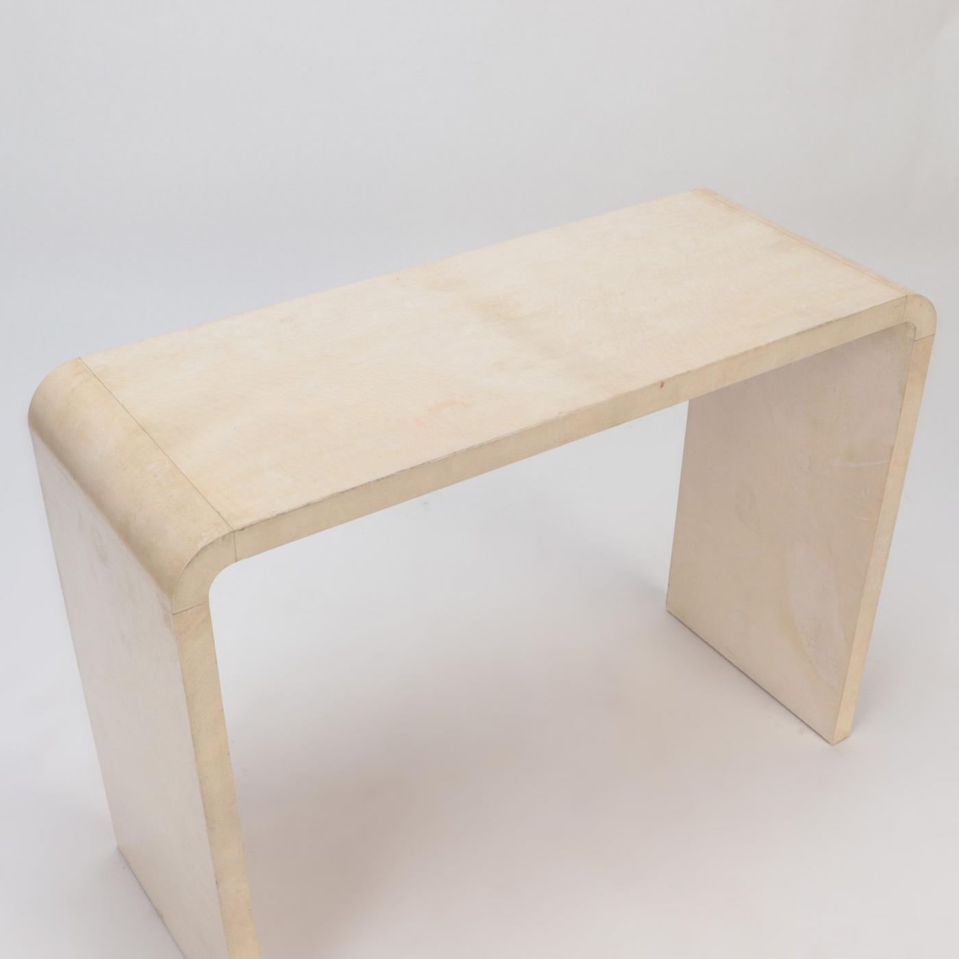A pair of parchment covered console tables. Contemporary.