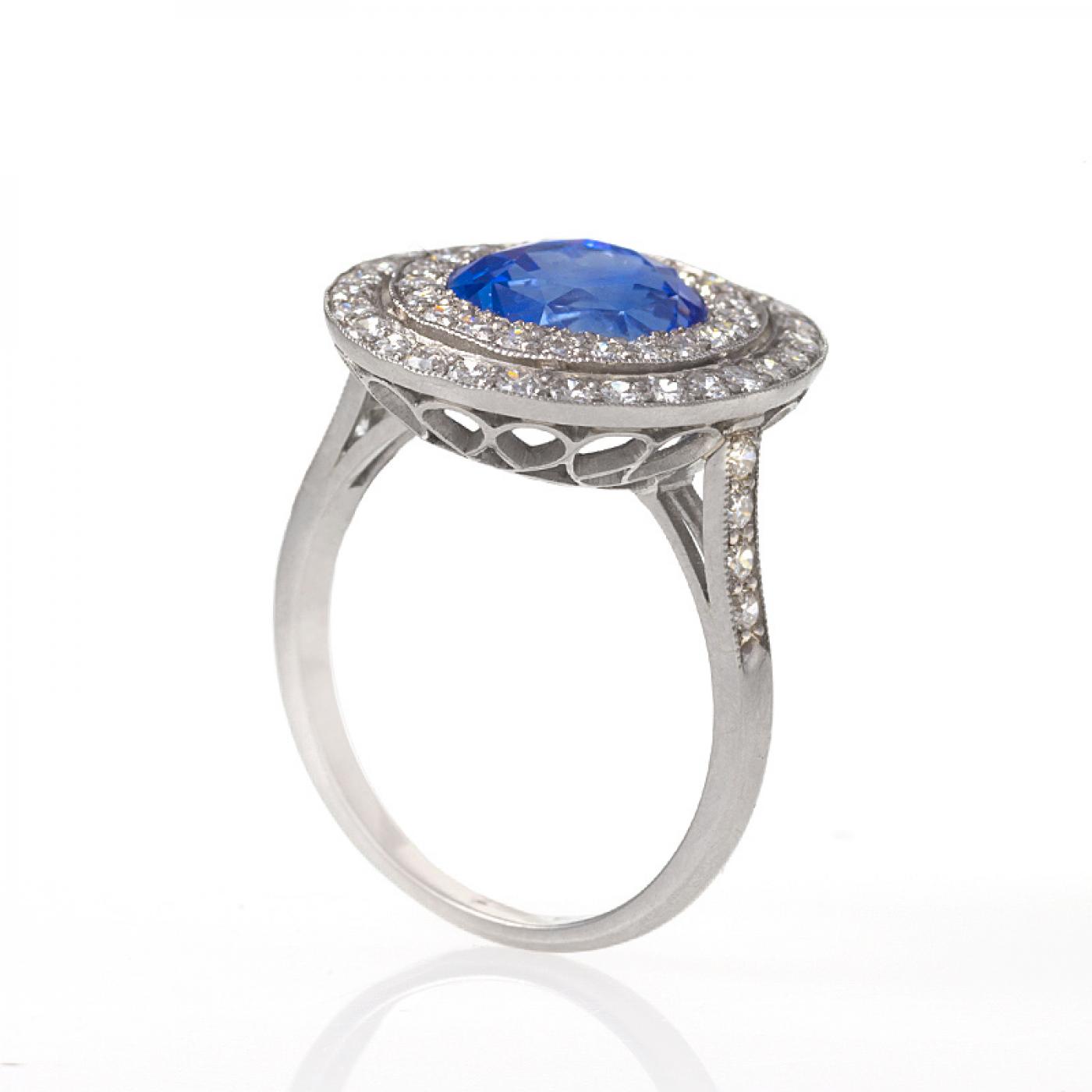 Blue Sapphire, Diamond and Platinum 'Halo' Ring