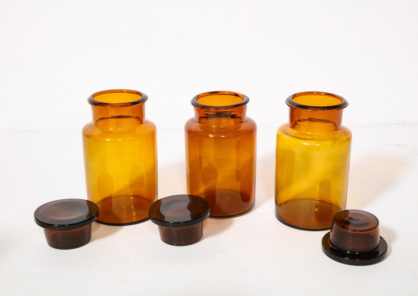 Collection of 7 Amber Glass Apothecary Jars