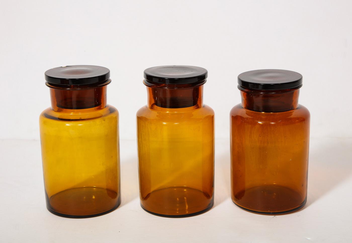Collection of 7 Amber Glass Apothecary Jars