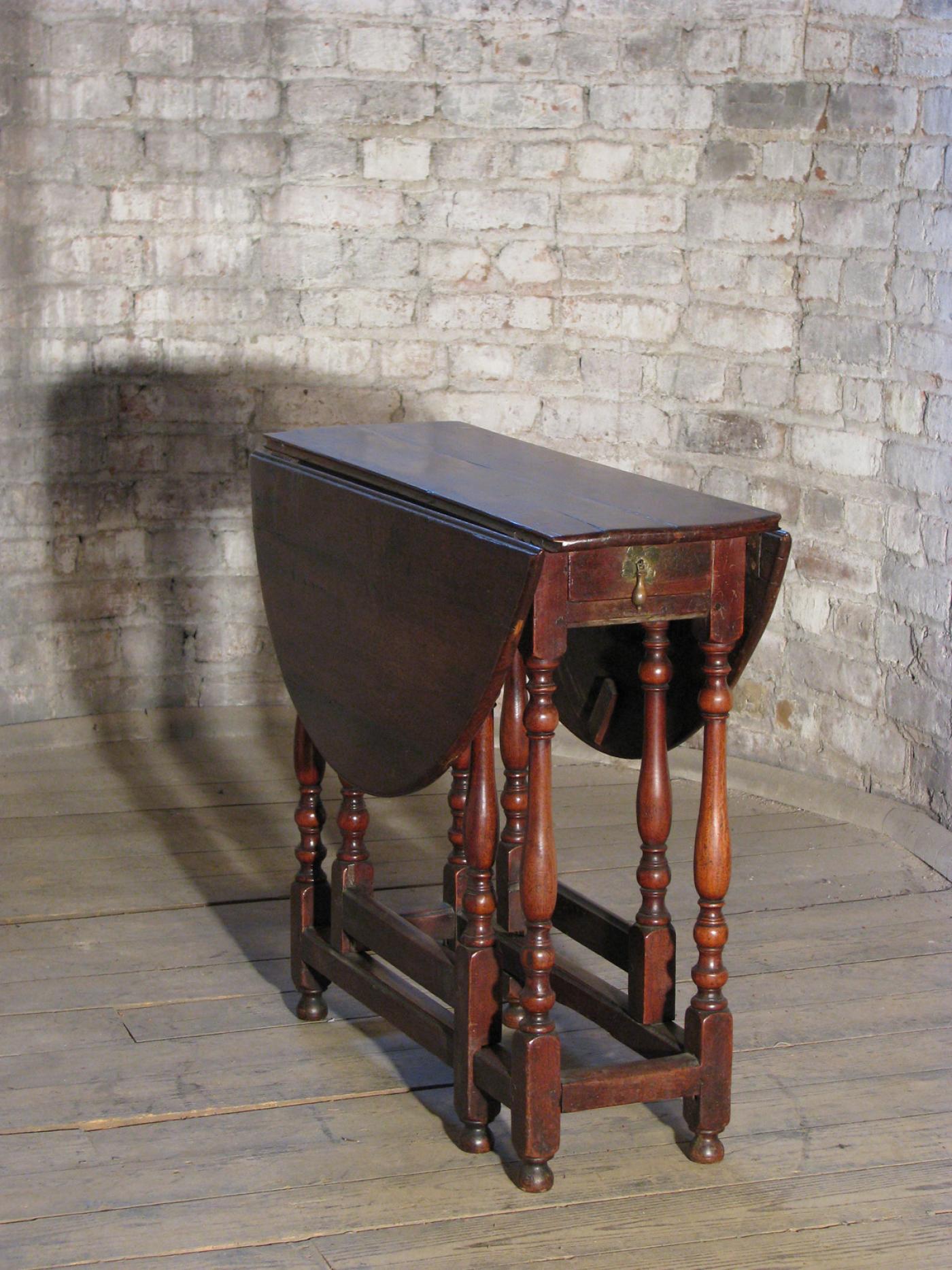 Early 18th Century English Walnut Oval Dropleaf / Gateleg Table