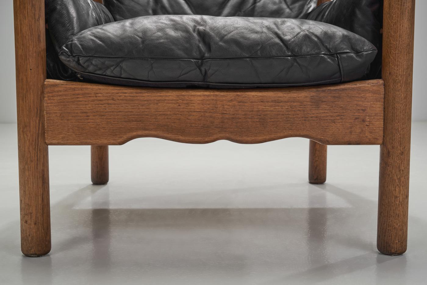 European Black Leather and Wood Lounge Chair, Europe ca 1950s