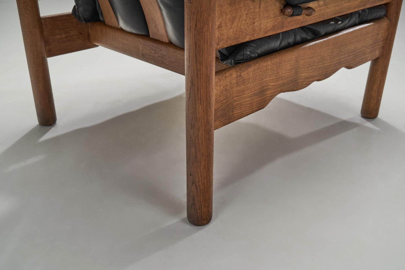 European Black Leather and Wood Lounge Chair, Europe ca 1950s