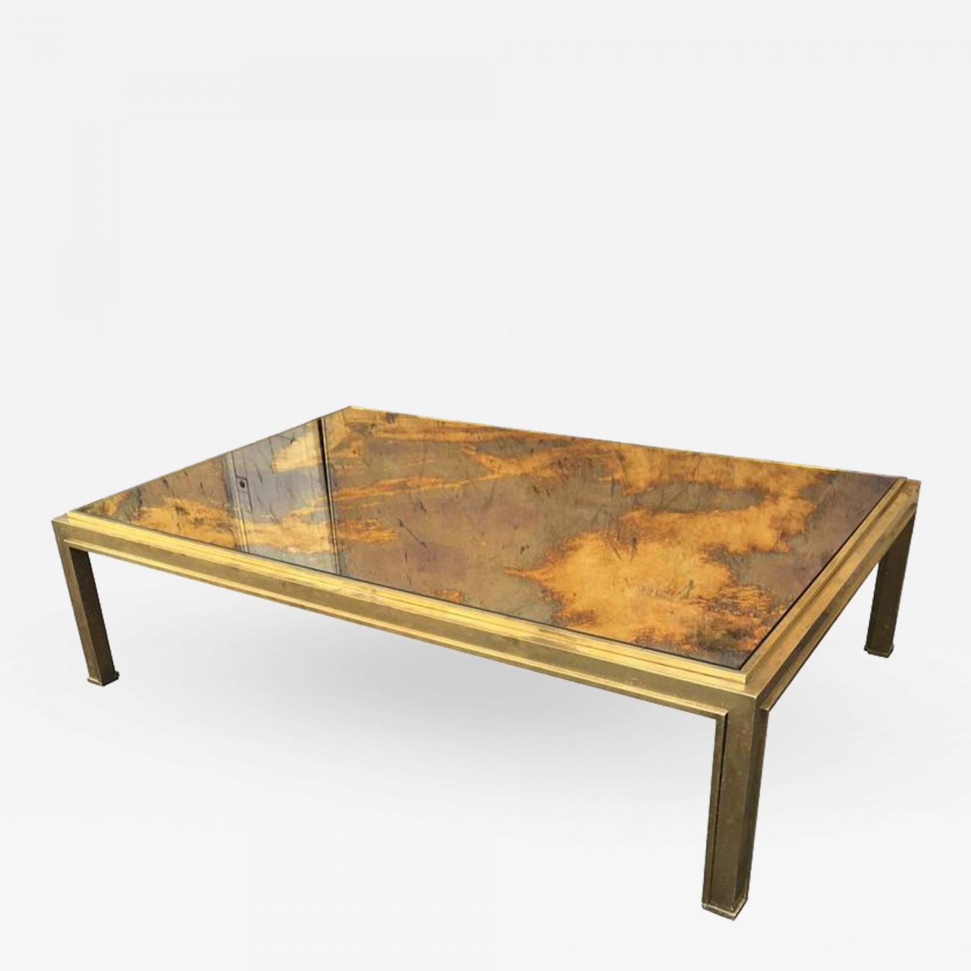 Jacques Adnet Jacques Adnet Sturdy Gold Bronze Big Coffee Table With A Gold Leaf Mirrored Top