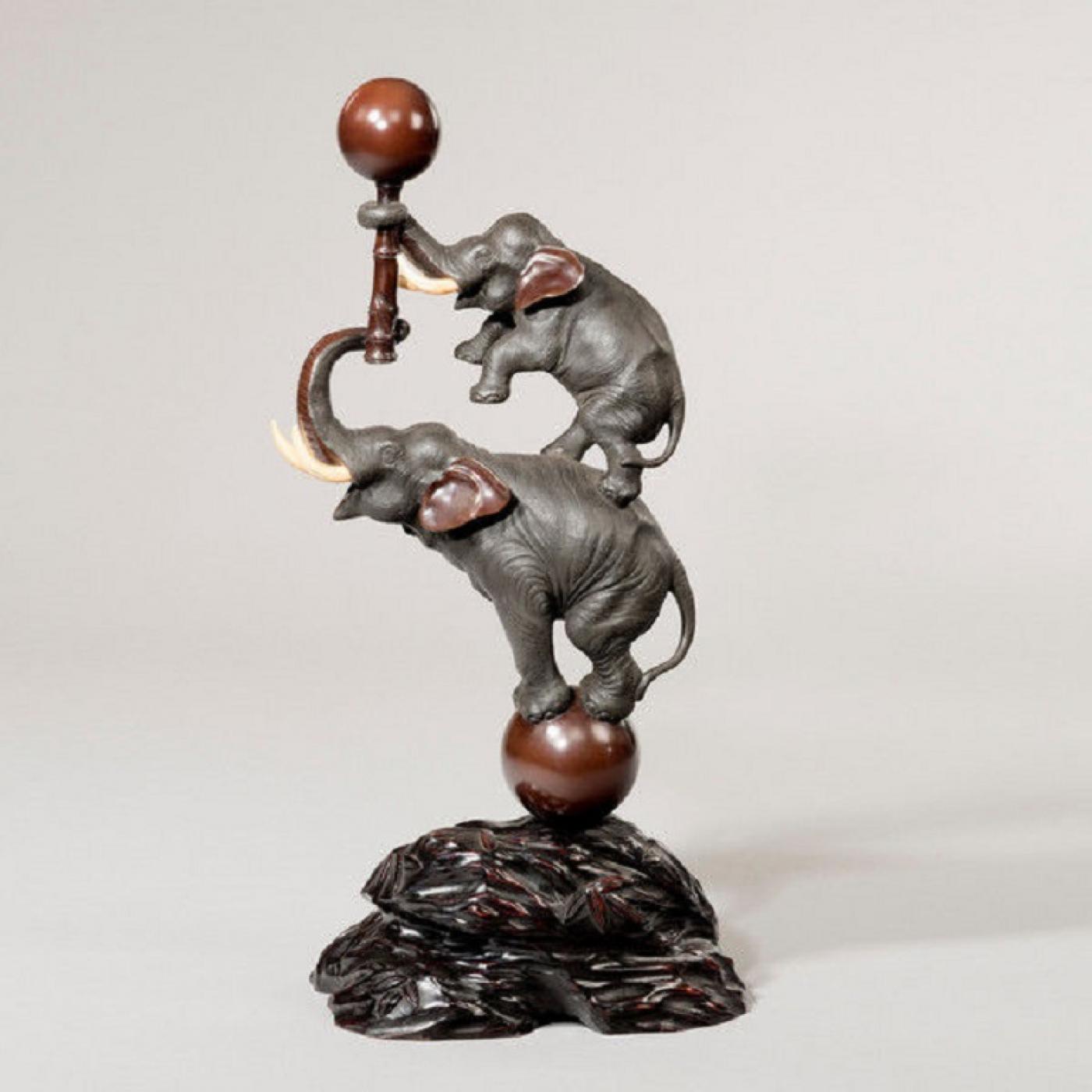 Meiji period bronze elephants set in its original hardwood stand