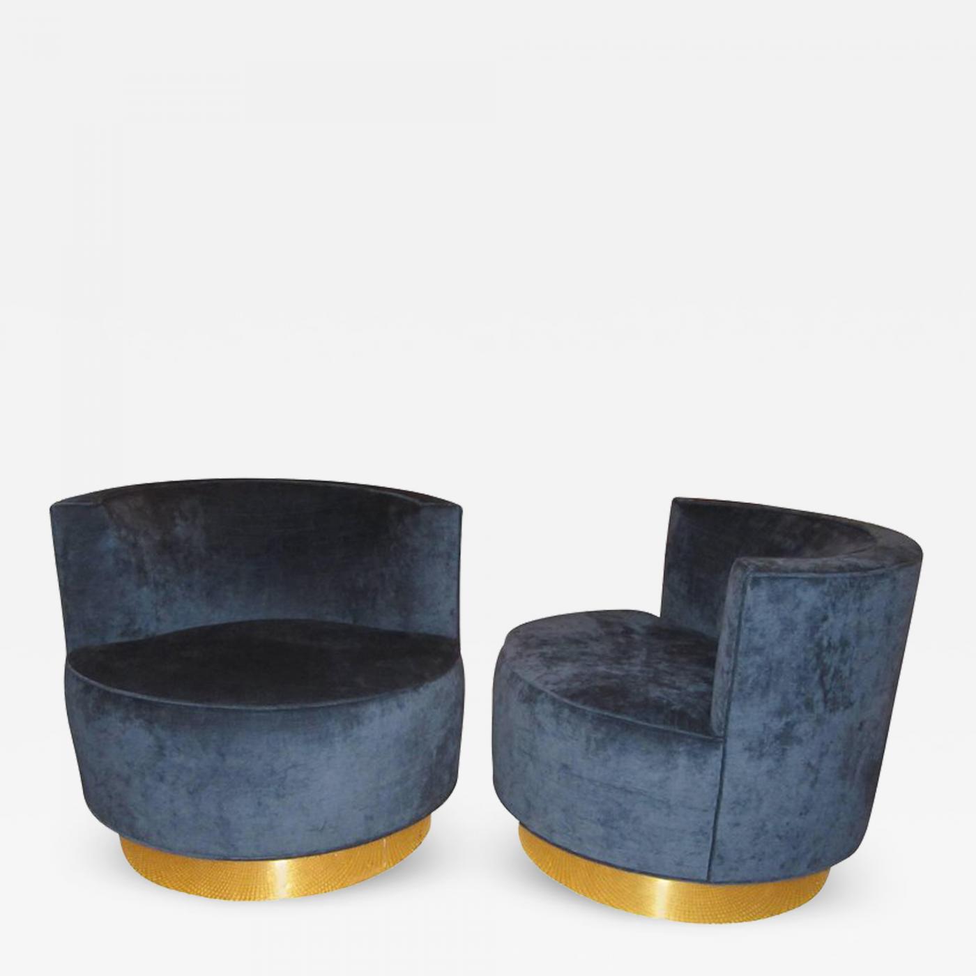 pair of midcentury modern swivel barrel chairs
