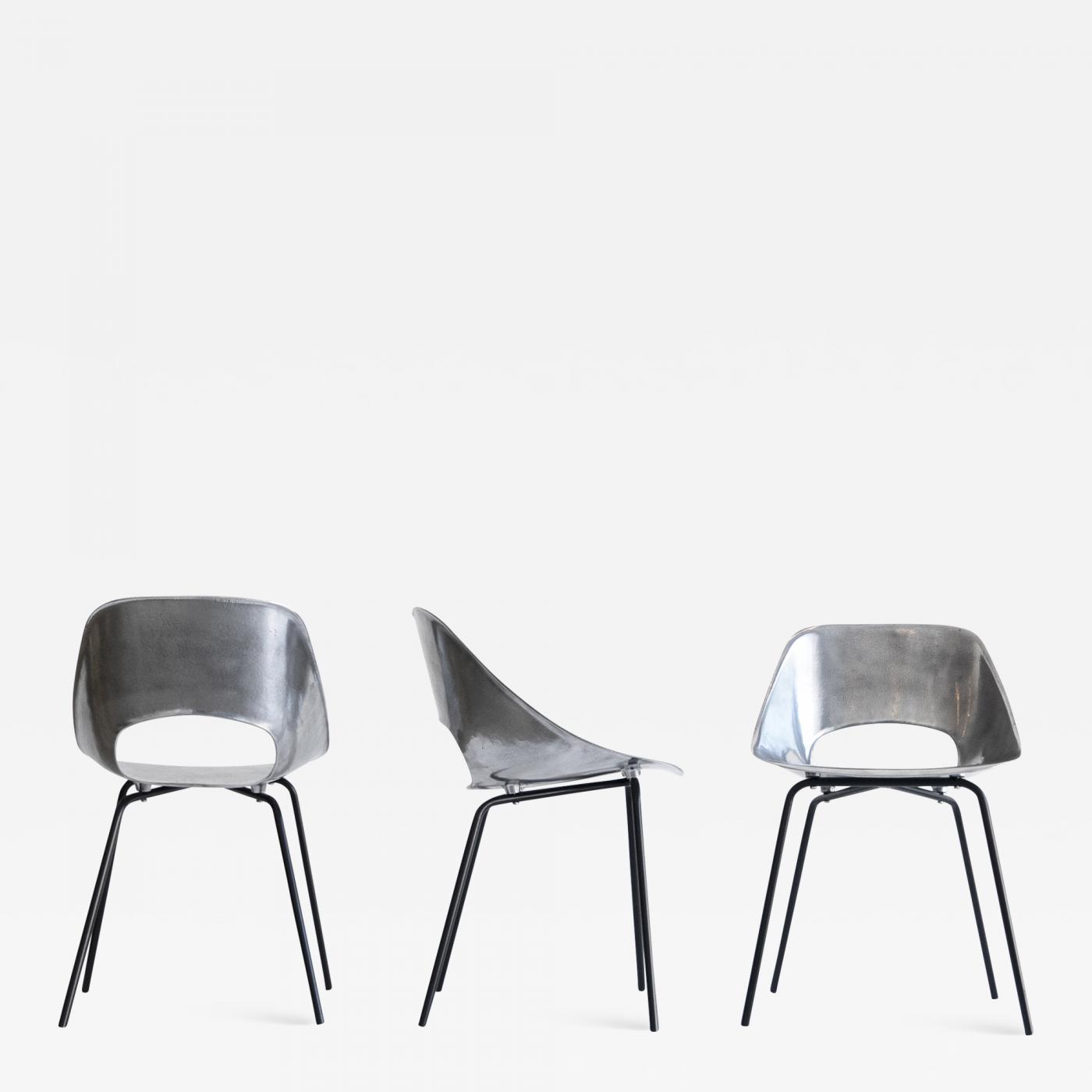 pierre guariche  pierre guariche set of three “tonneau” cast aluminum  chairs c 1950  1959
