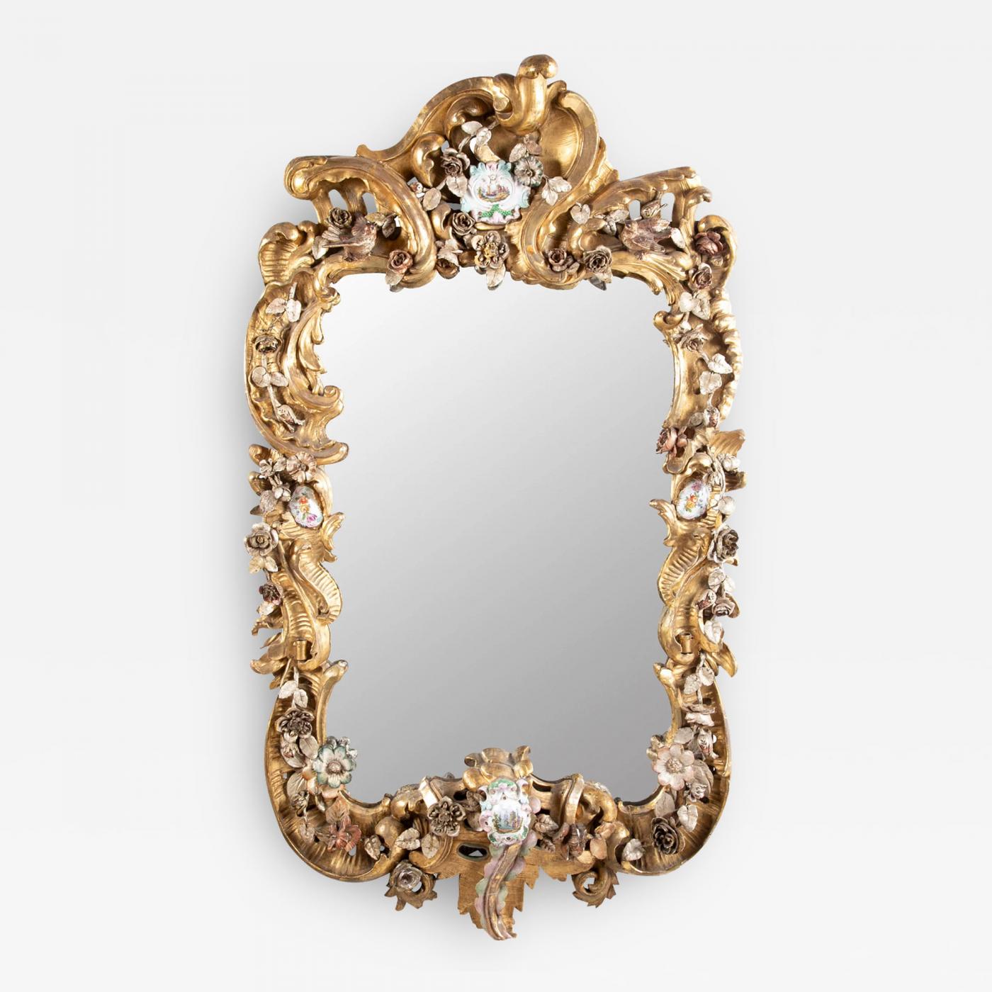 Rare Rococo German Giltwood Carved Mirror with Porcelain Medallions Insets Rare Rococo German Giltwood Carved Mirror with Porcelain Medallions Insets