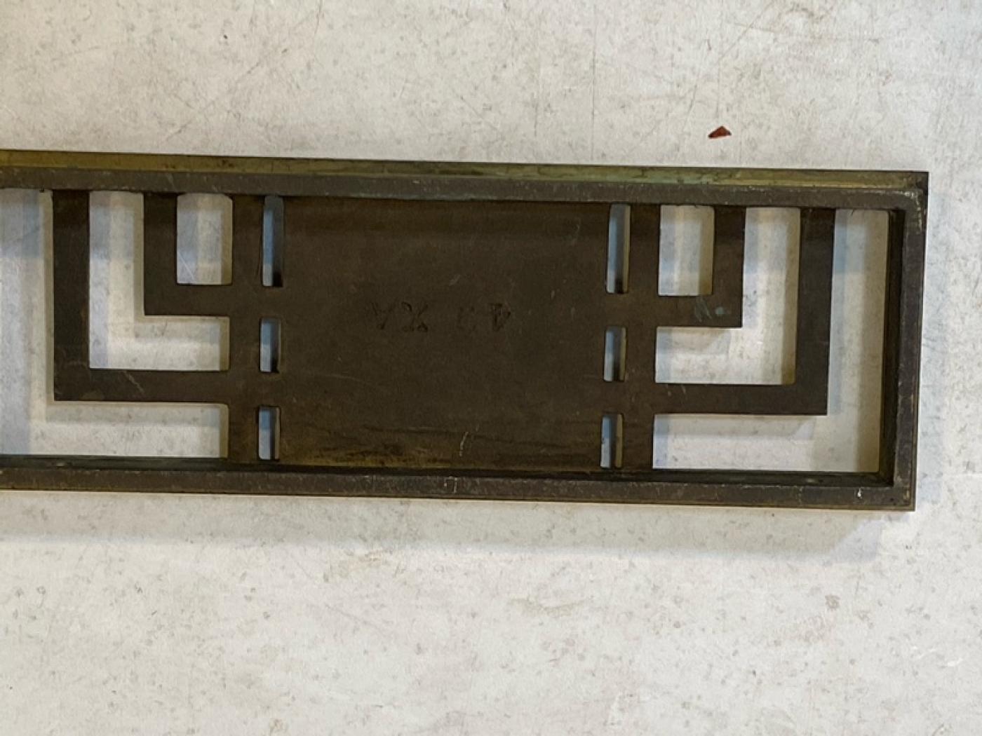 THREE BRONZE ART DECO ARCHITECTURAL RADIATOR COVERS