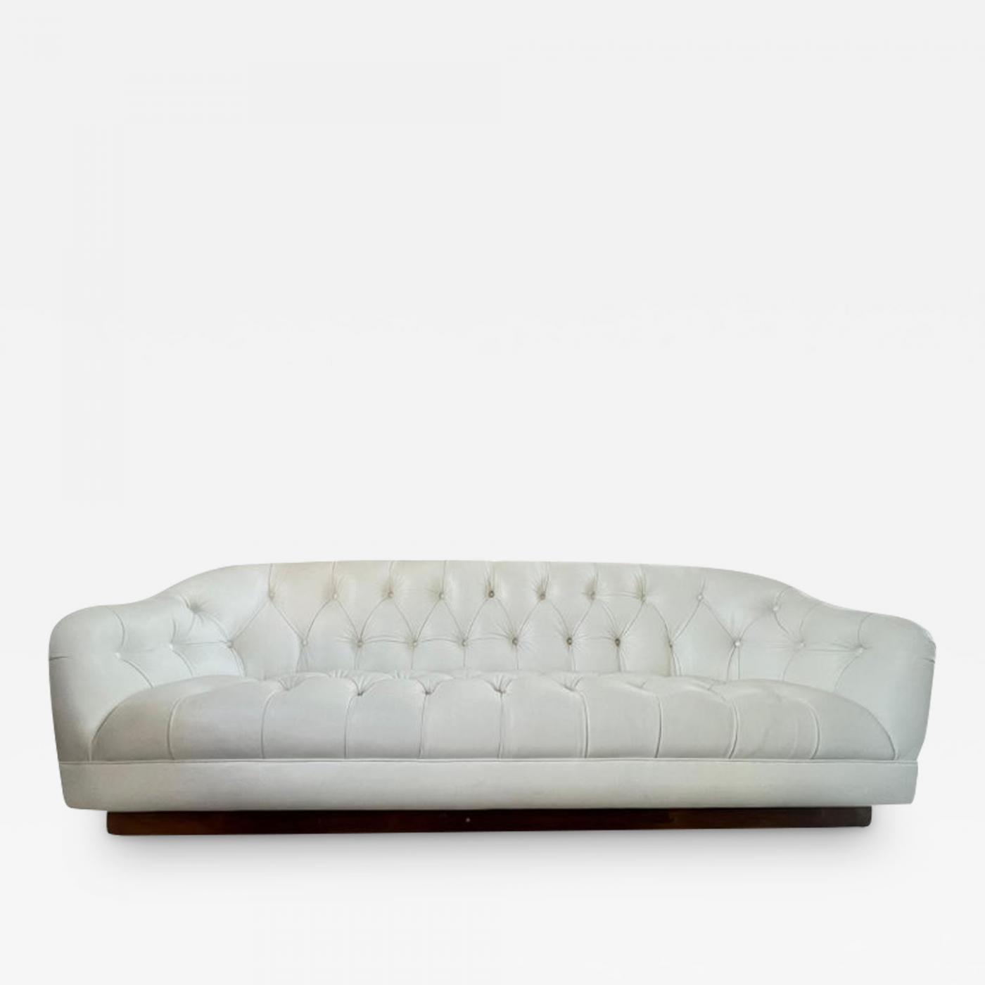 white leather tufted sofa