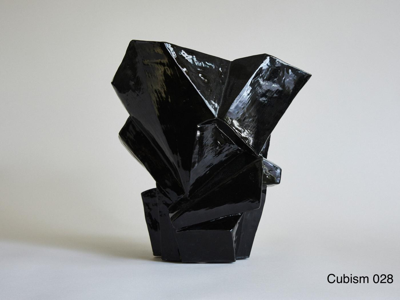 Wheel-thrown and manipulated cubist vessel.